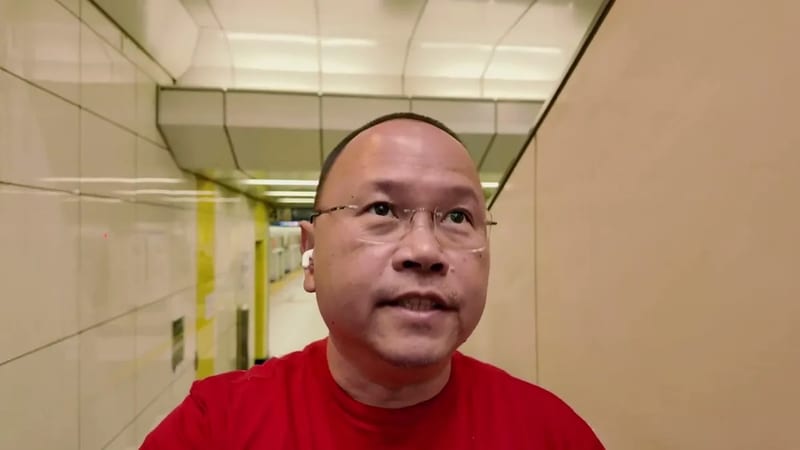 Selfie in a bright Tokyo subway tunnel walkway heading toward Tokyo Skytree, Japan