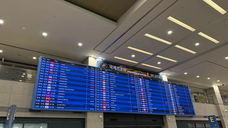 International arrivals board at Incheon Airport listing early morning flights from Hanoi, Manila, Bangkok and Ho Chi Minh City