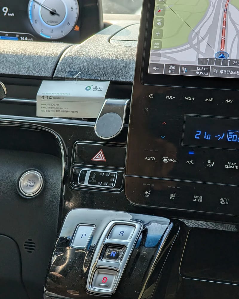 Close-up of the Hyundai Staria centre console with push button P R N D shifter, climate controls and heated seat buttons