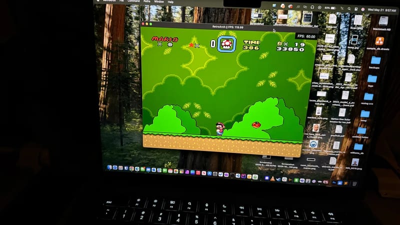 Laptop running a Super Mario World emulator to pass time on the flight