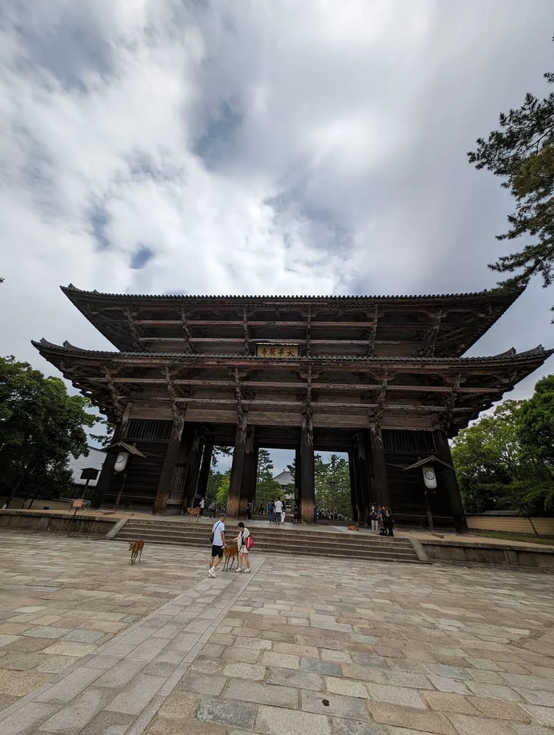 Wide view of Todai-ji Temple's grand wooden Nandaimon Gate in Nara, Japan.