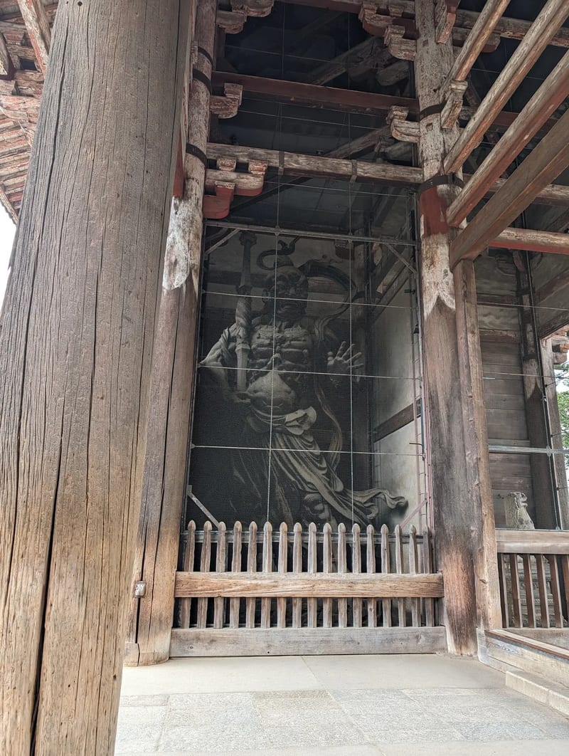 Close-up of a Nio guardian statue inside Todai-ji Temple's Nandaimon Gate in Nara, Japan.