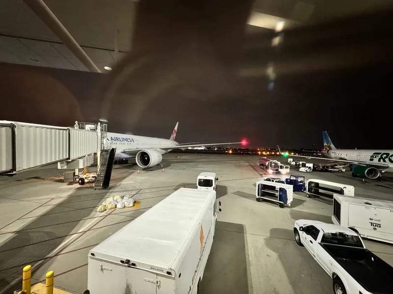 Japan Airlines plane at airport gate at night