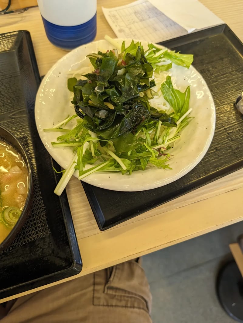Japanese seaweed salad side dish in a small bowl at a restaurant in Japan.