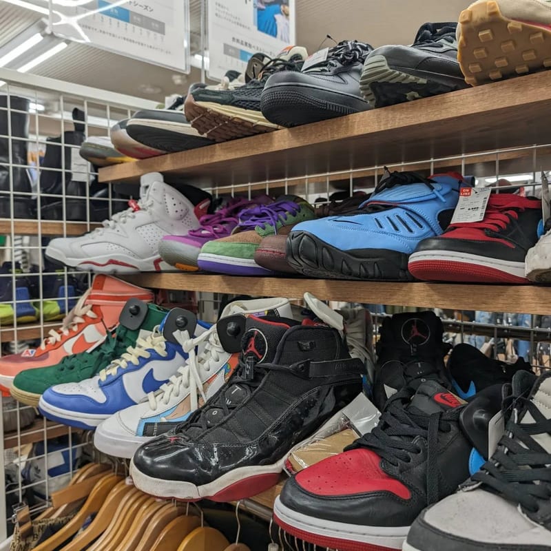 Shelf of used Nike and Jordan sneakers at Second Street resale store in Japan.