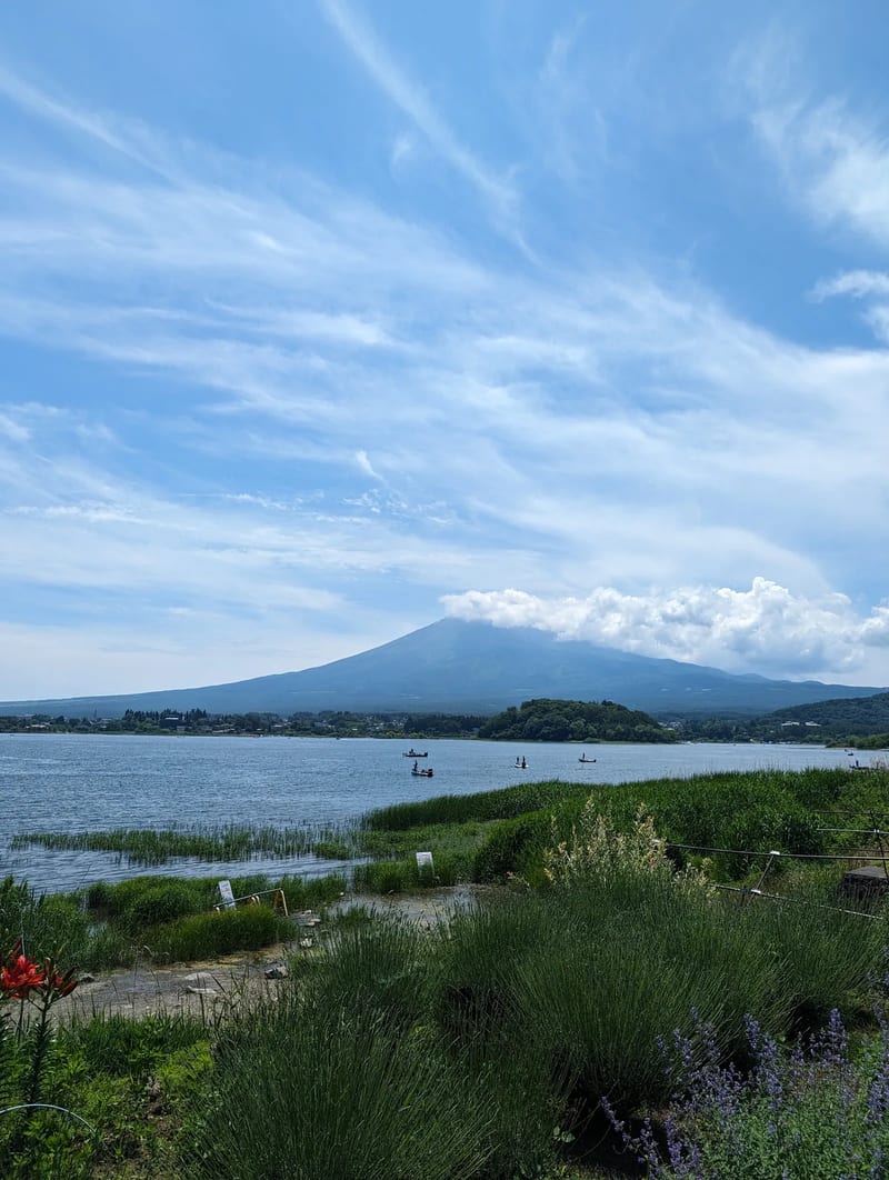 Lake Kawaguchi-ko with Mount Fuji partially obscured by clouds, Fujikawaguchiko, Yamanashi, Japan.