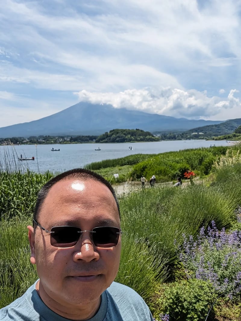 Selfie with Lake Kawaguchi-ko and mountains behind, Fujikawaguchiko, Yamanashi, Japan.