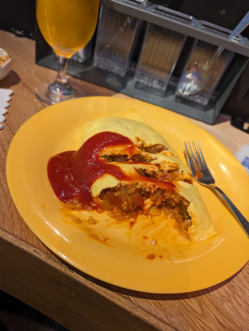 Omurice cut open — Tokyo, Japan Omurice cut open to reveal the fried rice filling inside, Tokyo, Japan.